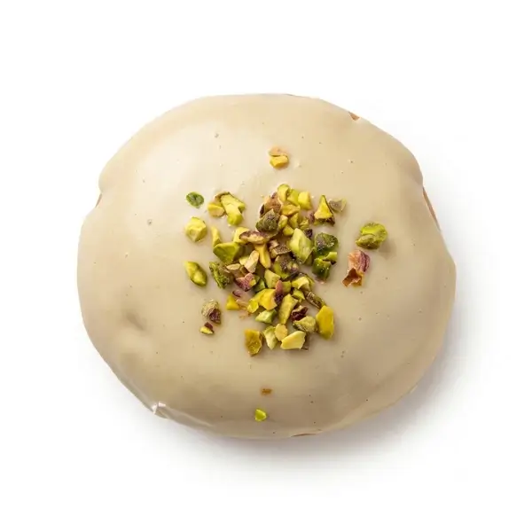Doughnut with pistachio-flavored filling and icing